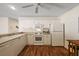Bright kitchen featuring white cabinets, modern appliances, and ample counter space at 2296 Whisper St, The Villages, FL 32162