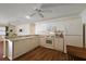 Bright kitchen featuring white cabinets, modern appliances, and ample counter space at 2296 Whisper St, The Villages, FL 32162