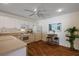 Bright kitchen featuring white cabinetry, modern appliances, and breakfast table at 2296 Whisper St, The Villages, FL 32162