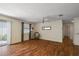 Bright living room showcases hardwood floors and natural lighting, offering a pleasant space at 2296 Whisper St, The Villages, FL 32162