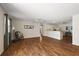 Spacious living room with hardwood floors, natural light, ceiling fans, and an open floor plan at 2296 Whisper St, The Villages, FL 32162