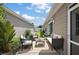 Outdoor patio with a comfortable seating area, perfect for entertaining guests at 2296 Whisper St, The Villages, FL 32162