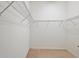 Walk-in closet with shelving for efficient storage at 24346 Amberleaf Ct, Leesburg, FL 34748