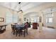 Open floor plan showcasing dining and living areas with ample natural light at 24346 Amberleaf Ct, Leesburg, FL 34748