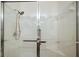 Bright shower area with white tiled walls and modern fixtures under recessed lighting at 24346 Amberleaf Ct, Leesburg, FL 34748