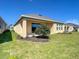 Backyard of home with grass and landscaping at 2675 Ridgetop Ln, Clermont, FL 34711