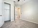 Bedroom showing closet, neutral carpet, and view to hallway at 2675 Ridgetop Ln, Clermont, FL 34711