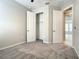 Bedroom showing closets, neutral carpet, and view to hallway at 2675 Ridgetop Ln, Clermont, FL 34711