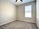 Bedroom with ceiling fan, neutral carpet, and natural light at 2675 Ridgetop Ln, Clermont, FL 34711