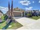 Attractive single-Gathering home with manicured lawn, two-car garage, and professionally landscaped front yard at 2675 Ridgetop Ln, Clermont, FL 34711