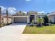 Beautifully landscaped single-Gathering home with a two-car garage and mature palm trees at 2675 Ridgetop Ln, Clermont, FL 34711