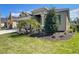 Well-maintained front yard with fresh mulch, and palm and shrub landscaping at 2675 Ridgetop Ln, Clermont, FL 34711
