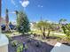 Lush front yard featuring palm and shrub landscaping along with a stately shade tree at 2675 Ridgetop Ln, Clermont, FL 34711