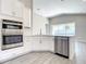 Bright kitchen with white cabinetry, stainless steel appliances, and wood-look tile flooring at 2675 Ridgetop Ln, Clermont, FL 34711