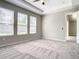 Spacious main bedroom with plush carpet, ceiling fan, and lots of natural light at 2675 Ridgetop Ln, Clermont, FL 34711