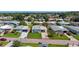 Aerial view of property with well-maintained landscaping at 3026 Myakka River Rd, Tavares, FL 32778