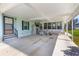 A covered carport and entry with space for sitting adds an outdoor living element to the home at 3026 Myakka River Rd, Tavares, FL 32778