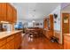 The open-concept dining area features hardwood floors and connects to the living area and kitchen at 3026 Myakka River Rd, Tavares, FL 32778