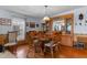 The dining room features hardwood floors and a large wood table with seating for six at 3026 Myakka River Rd, Tavares, FL 32778