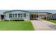 Charming single-story home with well-manicured lawn and covered parking at 3026 Myakka River Rd, Tavares, FL 32778