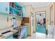 View of laundry room with desk, leading to sunroom at 3026 Myakka River Rd, Tavares, FL 32778
