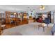Spacious living area with a dining area, a plush carpet, and an open floor plan at 3026 Myakka River Rd, Tavares, FL 32778