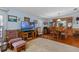 Cozy living room featuring ample seating and hardwood floors with great natural light at 3026 Myakka River Rd, Tavares, FL 32778