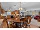 Open layout combining the kitchen, dining, and living areas for seamless entertaining at 3026 Myakka River Rd, Tavares, FL 32778