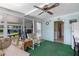 View of sunroom with casual seating and view into house at 3026 Myakka River Rd, Tavares, FL 32778