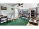 Enclosed sunroom with windows, ceiling fan, and casual seating at 3026 Myakka River Rd, Tavares, FL 32778