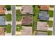 Bird's eye view of a landscaped home with manicured lawn and surrounding residences in a quiet neighborhood at 3041 Batally Ct, The Villages, FL 32162