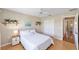 Bright bedroom featuring a full bed, hardwood floors, bright window, and closet at 3041 Batally Ct, The Villages, FL 32162