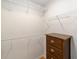 Walk-in closet with wire shelving and wooden drawers at 3041 Batally Ct, The Villages, FL 32162