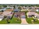 Charming single-story home featuring a well-manicured lawn, brick driveway, and an inviting exterior at 3041 Batally Ct, The Villages, FL 32162