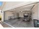 Spacious two car garage equipped with a golf cart and ample storage at 3041 Batally Ct, The Villages, FL 32162