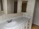 Bathroom vanity with drawers, mirror, and sink at 323 Hawthorne Blvd, Leesburg, FL 34748