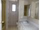 Bathroom featuring a vanity, toilet, and shower/tub combo at 323 Hawthorne Blvd, Leesburg, FL 34748