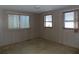 Bedroom featuring three windows and carpet flooring at 323 Hawthorne Blvd, Leesburg, FL 34748
