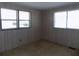 Comfortable bedroom with natural light from two windows at 323 Hawthorne Blvd, Leesburg, FL 34748