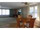 Dining room with wood floors and bright windows at 323 Hawthorne Blvd, Leesburg, FL 34748