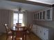 Open dining space with built in cabinetry adjacent to dining table at 323 Hawthorne Blvd, Leesburg, FL 34748