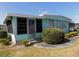 Charming single-story home featuring a screened room and well-maintained landscaping at 323 Hawthorne Blvd, Leesburg, FL 34748