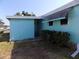 Exterior of home showcasing siding and back yard at 323 Hawthorne Blvd, Leesburg, FL 34748
