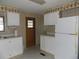 Efficient kitchen layout with essential appliances and storage solutions at 323 Hawthorne Blvd, Leesburg, FL 34748