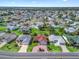Expansive aerial view of a well-maintained community showcases the home’s prime location and neighborhood layout at 3266 Woodridge Dr, The Villages, FL 32162