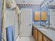Bathroom view showcasing the vanity, shower, and interior design at 3266 Woodridge Dr, The Villages, FL 32162