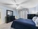 Bright bedroom features a large dresser and window for natural light at 3266 Woodridge Dr, The Villages, FL 32162