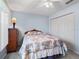 Bedroom features a closet, large window, and soft carpet flooring at 3266 Woodridge Dr, The Villages, FL 32162