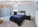 Comfortable bedroom with light blue walls, ceiling fan, and soft carpet at 3266 Woodridge Dr, The Villages, FL 32162