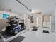Garage with a golf cart, refrigerator, washer, and dryer at 3266 Woodridge Dr, The Villages, FL 32162
